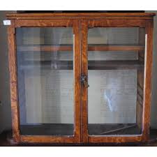 Oak wall mounted display cabinet. A Victorian Oak Two Door Glazed Wall Hanging Display Cabinet Auctions Price Archive