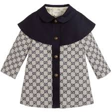 A Smart And Stylish Navy Blue And Ivory Coat For Baby Girls By Luxury Brand Gucci In The Brand S Gg Logo Weave It Has A Cloa Clothes Kids Coats Gucci Kids