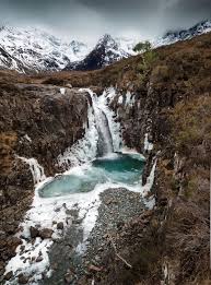 Isle Of Skye With Those Incredible Fairy Pools Beneath The Dusted Black Cuiliins Fairy Pools Isle Of Skye Beautiful Sites