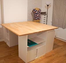 Ana white will show you how to make your own modern craft table!lots of storage, tons of workspace on top, and there is a spot for two counter stools at the opposite ends of the table so kids can have their own spot to craft/color. Diy Huge Sewing Table For A Craft Room Custom Storage Shelving Unit 15 Steps With Pictures Instructables