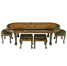 It has the perfect design to enhance your room décor. Chinese Oval Coffee Table With Hand Carved Battle Scene And Six Stools For Sale At 1stdibs