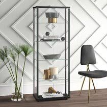 The two doors of the cabinet open to reveal two interior shelves that are perfect for clearing away clutter. Narrow Display Cabinet Wayfair