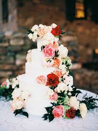 Wedding cakes and flowers are a match made in wedding heaven. Wedding Cake Flowers White Almond Wedding Cake