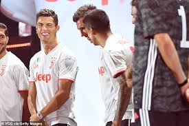 The replica home jersey costs €104.95 (£93.12/$122.86) and can be further customised to add the champions league logo for an additional €10 (£8.87/$11.71). Juventus News Cristiano Ronaldo Joins Team Mates To Launch Brand New White And Red Away Kit Daily Mail Online
