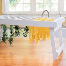 You should not balance the drying rack on top of a tower of containers of litter and a paint can. Diy Drying Rack For Pasta Herbs And More Diy Mother Earth News