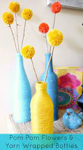 Pom pom crafts flower crafts yarn crafts pom pom diy pom pom garland crafts to sell diy and crafts crafts for kids arts and crafts. Pom Pom Flowers Yarn Wrapped Bottles Everythingetsy Com
