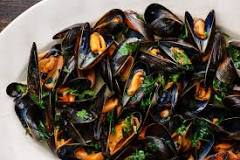 What texture should mussels be when cooked?