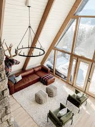 The New Cabin Chandeliers What S Working And What S Not Cabin Chandelier Modern Cabin Interior Cabin Room Design