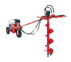 Homemade hydraulic pump constructed from motorcycle transmission parts. Hydraulic Earth Drills Little Beaver