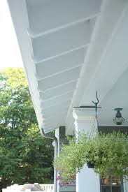 The Exposed Rafter Tails On This Newer Home Give The Home The Feel Of A Much Older Home When Details Mattered A Exposed Rafters Cottage Exterior House Exterior