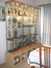 Unbalanced Lighting Creates Areas Of Overexposure Of Some Figures And Darkness Of Others Shelves Ikea Detolf Display Case