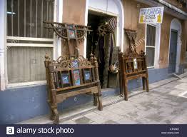 Download This Stock Image A Shop Front With Traditional Beds On Display In Zanzibar Tanzania East Africa Atn54d From A In 2020 Traditional Bed Zanzibar Carved Doors