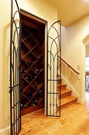 Adjacent To The Family Room Dining Room And Staircase To The Third Floor Is Nestled The Wine Cellar Wrough Wine Closet Wine Cellar Door Iron Wine Cellar Door