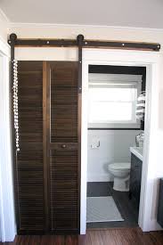 Beautiful bathroom barn door crafted from reclaimed black walnut lumber [design: Diy Barn Door Hardware