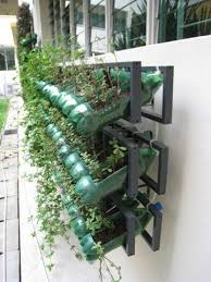 Vertical Garden From Soda Bottles 1001 Gardens Vertical Garden Diy Vertical Garden Vertical Vegetable Gardens