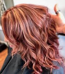 When done right, vibrant colors like this gorgeous redhead shine just beautifully when accentuated with warm blond streaks. 7 Beautiful Burgundy Hairstyles With Blonde Highlights