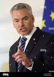 Austrian Chancellor Karl Nehammer addresses the media during a press  conference as part of a migration summit in Vienna, Austria, Friday, July  7, 2023. (AP Photo/Heinz-Peter Bader Stock Photo
