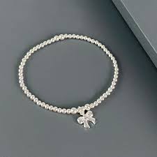 I am desperate to find a beautiful silver gift for my niece's 21st birthday present in readiness for her arrival in bali at the end of the week, i thought i would have had plenty of time to wander around and try and find her a lovely silver braclet etc but with my twin girls in tow its proving to be. Sterling Silver Bow Bracelet Womans Gifts Evy Designs