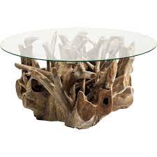 Its solid mango wood is finished in a light, slightly gray hue that fits beautifully with eclectic, coastal and even farmhouse styles, too. Ethnic Wooden Coffee Table Roots Kare Design