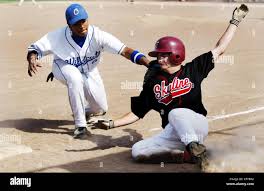 Skyline's Daniel Richman, right, slides back to third base as Oakland's  Blair Burroughs attempts to tag him during the third inning at Oakland High  in Oakland, Calif.,