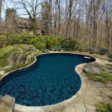 Curved Pool And Stone Slab Pool Deck With Accent Rocks Source Sotheby S Estates Freeform Pools Pool Patio Pool Houses