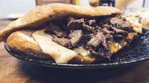 When hot add the oil, onions and bell peppers, and cook, stirring, until caramelized, about 6 minutes. Spicy Philly Cheesesteak Sandwich With Hot Sauce And Home Made Garlic Butter Heatsupply