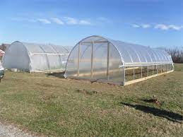 The hoop house can be seasonally placed over a raised garden bed to protect tender plants from frost and cold temperatures. How To Build A Greenhouse Or Hoop House