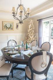 Effortless elegance, inviting warmth, and style that transcends trends. Christmas Table Decorations Elegant Gold Aqua Dining Room