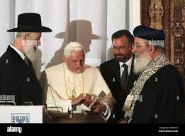 NO FILM, NO VIDEO, NO TV, NO DOCUMENTARY - Pope Benedict XVI, receives a  gift from Israeli chief Rabbis Shlomo Amar, right, and Yona Metzger, left,  at the center for the Jewish