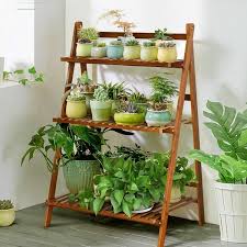 The 3 Tier Bamboo Flower Pot Shelf Is Perfect For Your Outdoor Space The Light Brown Color Is Neutral To Comp Plant Shelves Wooden Plant Stands Bamboo Ladders