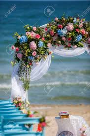 Fall wedding arches wedding ceremony flowers fall wedding decorations ceremony arch floral wedding autumn wedding arch | wild blooms. Wedding On The Beach Wedding Arch Decorated Of Blue Material Stock Photo Picture And Royalty Free Image Image 143608446