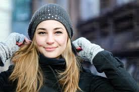A woman wearing a white coat and a white hat photo