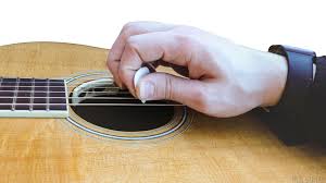 This position is what most guitar teachers learn. How To Hold The Pick Hub Guitar