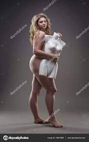 Young beautiful blonde naked plus size model with dummy, xxl nude woman on  gray studio background Stock Photo by ©starast 135010896