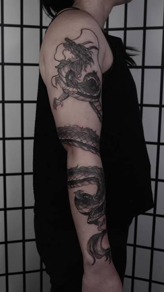 Fineline realistic Dragon tattoo wrapping arm black work //12 hours one session work // thank you for trusting for this creative work with me ! , sternum // spine // chest // collar bone tattoo ...