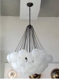 Take yourself back to those simple times with this playful light. Lighting Mashup From Nyc S Apparatus Remodelista Balloon Chandelier Balloon Decorations Balloon Ceiling