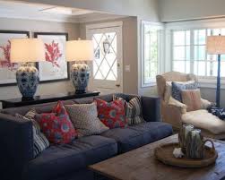 Keeping the ceiling white creates the illusion of the height. Denim Blue Sofas For Uniquely Timeless Look In Your Living Space Blue Living Room Living Room Orange Living Room Designs