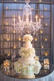 Cakes Desserts Photos Cake Displayed Under Chandelier Extravagant Wedding Cakes Extravagant Wedding Wedding Cake Table