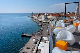 View From The Roof Of Hotel Piran With A Row Of Seaside Restaurants In The Middle Distance Picture Of Hotel Piran Tripadvisor