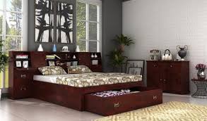 Because the bed frame holds your mattress, it is one of the most essential pieces of furniture when it comes to your bedroom. Buy Harley Storage Bed With Bedside King Size Mahogany Finish Online In India Wooden Street Furniture Bed Design Modern Double Bed Designs