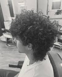 Summer vibes are in full swing, and nothing says 'cool' like a perfectly  styled mullet with those natural curls. It's the ultimate combination of  classic and contemporary that we love to create