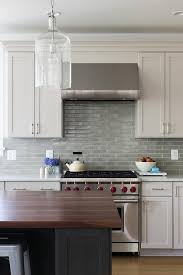 Example Of A Classic Gray Light Green And White Kitchen Design With Glazed Backsplash Tiles White White Kitchen Design Kitchen Cabinet Remodel Kitchen Design