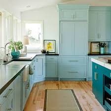 Custom kitchen with turquoise cabinets. Southern Living Roomoftheday We Love This Creative Kitchen Cabinet Idea A Deep Teal Shade Of Benjamin Moore Bermuda Turquoise On The Island Stands Out Against The Light Aqua Cabinets In Benjamin