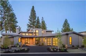 This resilient paver driveway has actually a put concrete style with irregularly shaped pavers in the middle. Modern House Plans Home Designs The Plan Collection