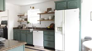 Lay doors on painter's pyramids so you can more easily maneuver a brush around the bottom edges. How To Paint Kitchen Cabinets Country Chic Paint