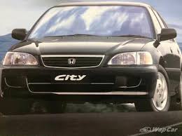 Ajukan pertanyaan tentang tugas sekolahmu. Bagaimana Honda City Mengorak Langkah Daripada Sebuah Kereta Ringkas Sehingga Boleh Menggugat Toyota Camry Wapcar