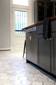 This beautiful contemporary gray and white kitchen offers a large open plan layout with an island big enough to seat three eat in diners. 43 Practical And Cool Looking Kitchen Flooring Ideas Digsdigs