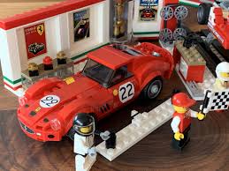 With a lift, trophy case. Ferrari Ultimate Garage Speed Champions