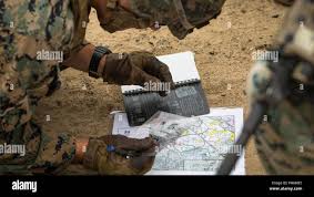 U.S. Marine Corps Cpl. Aaron Oscar, a digital wideband system maintainer,  with 1st Radio Battalion, I Marine Expeditionary Force Information Group,  fires a M2 .50 caliber machine gun during a basic machine