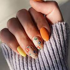 With sally hansen's chrome silver and bent detail nail art brush paint the floral detail design on middle and ring finger: 31 Flower Nail Art Designs Pretty Floral Manicures For 2021 Glamour